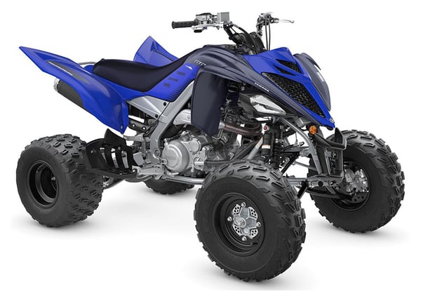 2023 Yamaha Raptor 700R Blue Sport ATV parked in display room