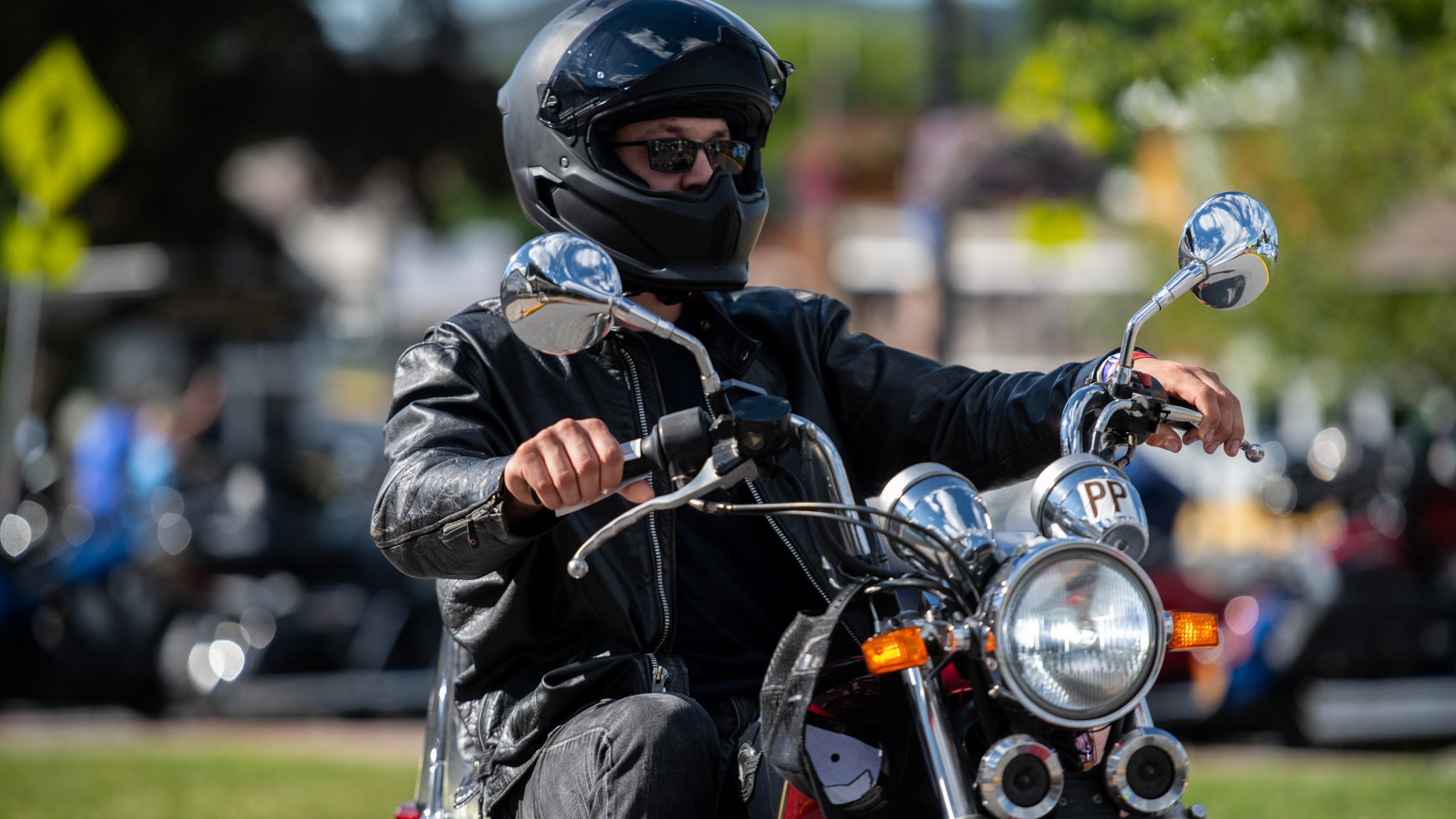 Solo motorcycle rider practicing safety by wearing helmet