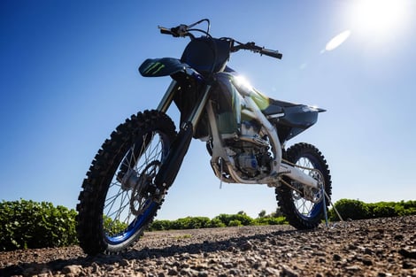 Best Dirt Bike Brand: 2023 Yamaha parked on gravel road