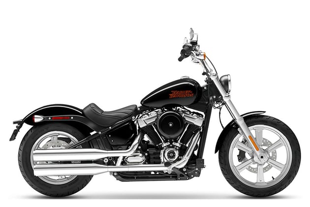 Brand new 2023 Harley-Davidson Softail Standard in all-black with red accents, showcased in RideNow showroom.