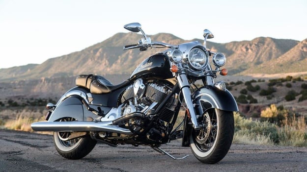 Conquer the road with the black and chrome Indian Chief - a powerful motorcycle with stunning mountain views in the background