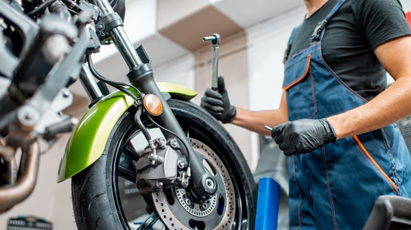 Expert maintenance for your motorcycle - a skilled technician works on a bike with precision and care