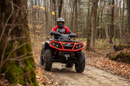 Red Can-Am Outlander with Front Bumper Riding Through Forest Trail - Off-Road ATV Adventure