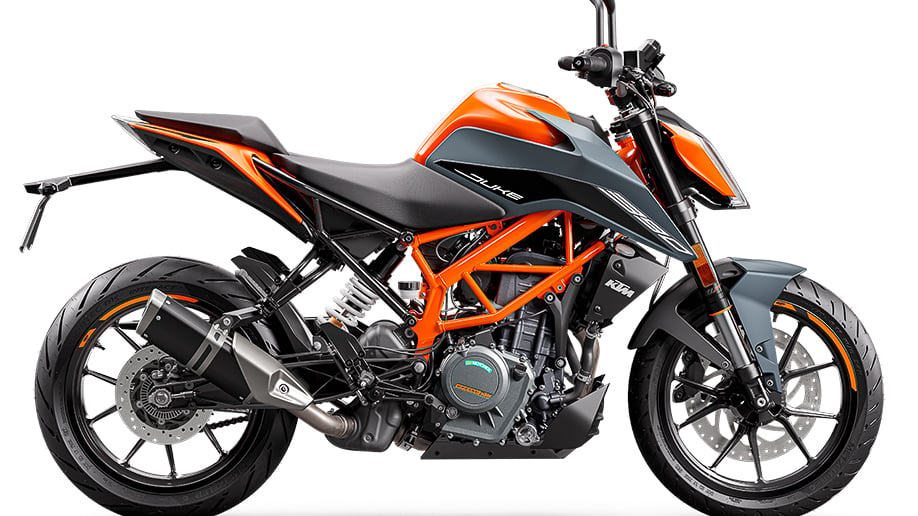 The KTM 390 Duke features bright orange fairings, with black detailing along the body. It is the newest Duke in KTM's 2023 lineup. 