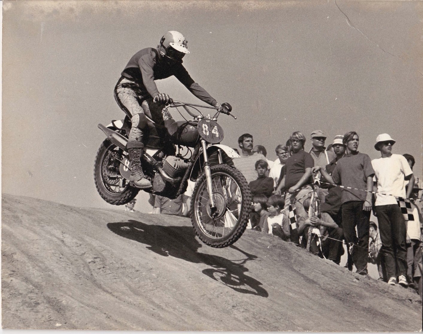 AMA Hall of Famer Mary McGee jumping a hill on a motorcycle during a 1967 race, showcasing her legendary skills