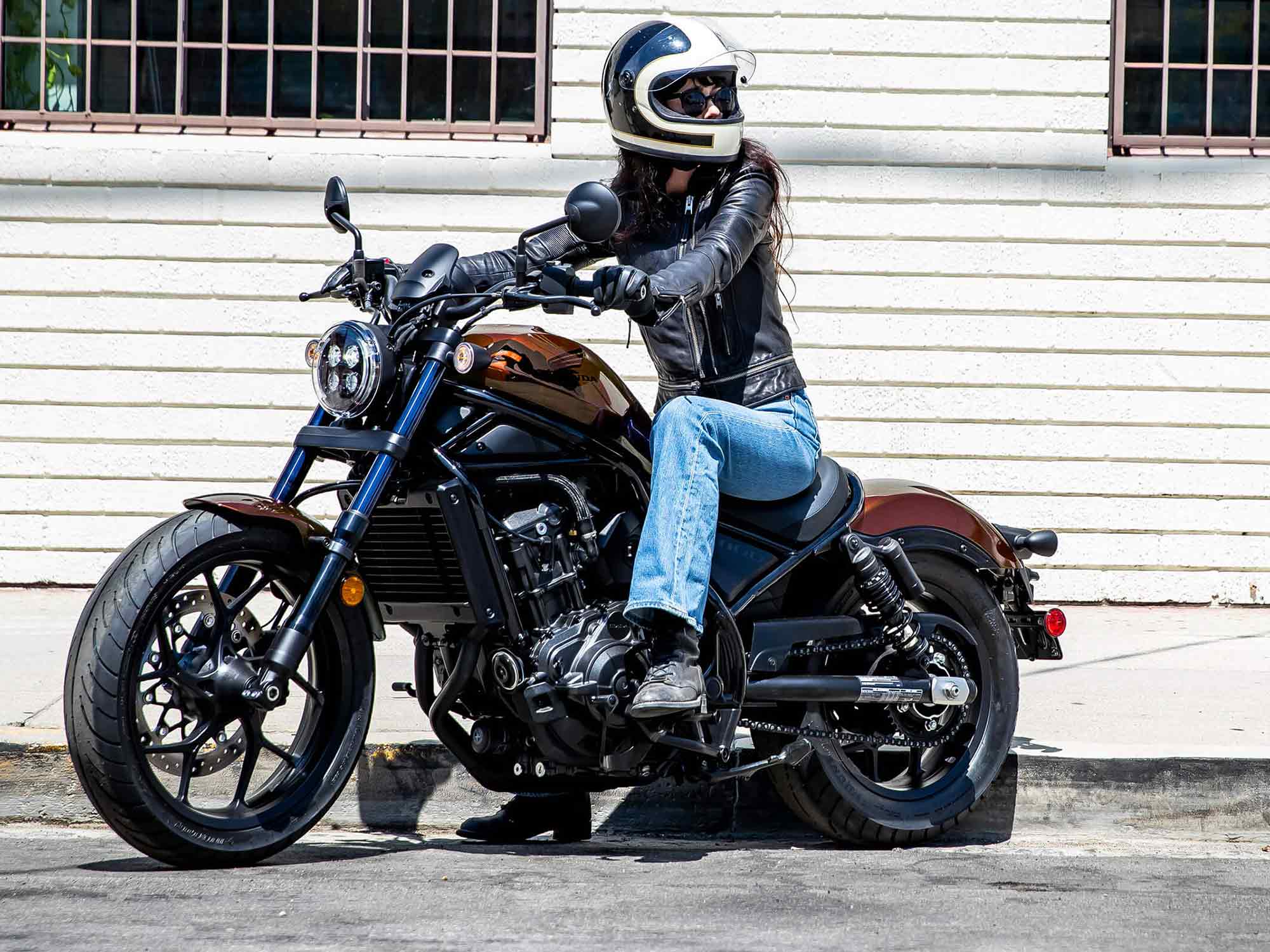 Feel the freedom of the open road with a woman motorcyclist getting ready to take off