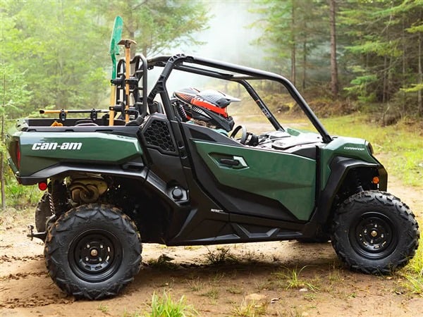 Green Can-Am Commander parked on forest trail - Off-road UTV adventure
